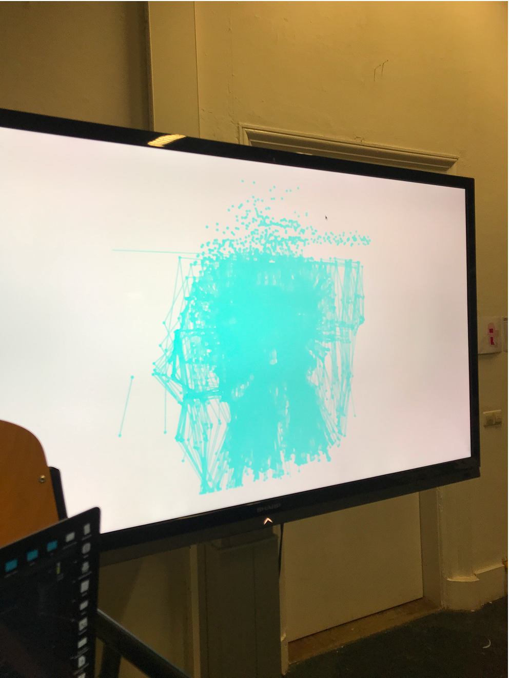 Tv screen with a white canvas and multiple abstract skeletons layered over each other